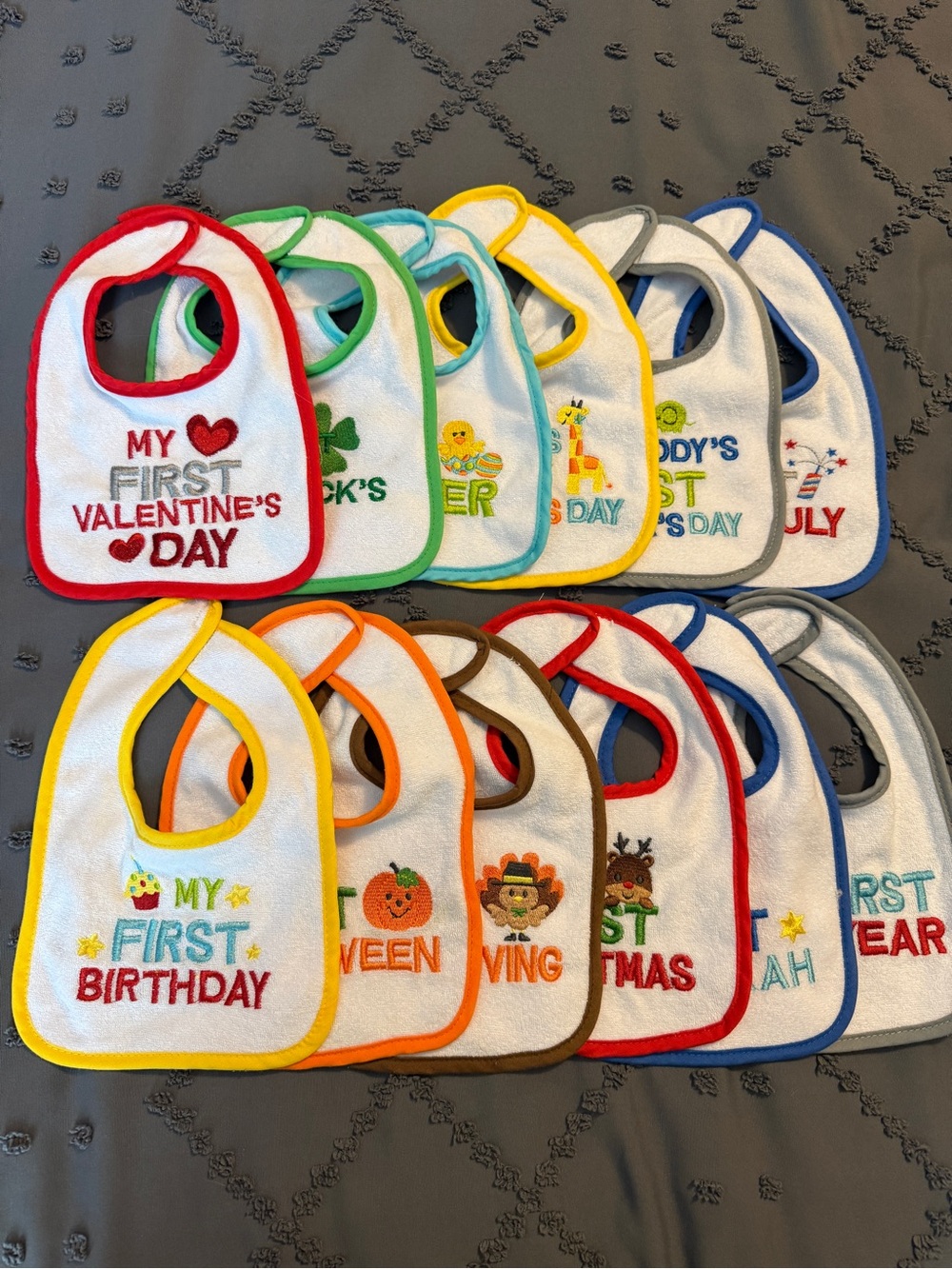 Set of 12 “First Holiday” Bibs